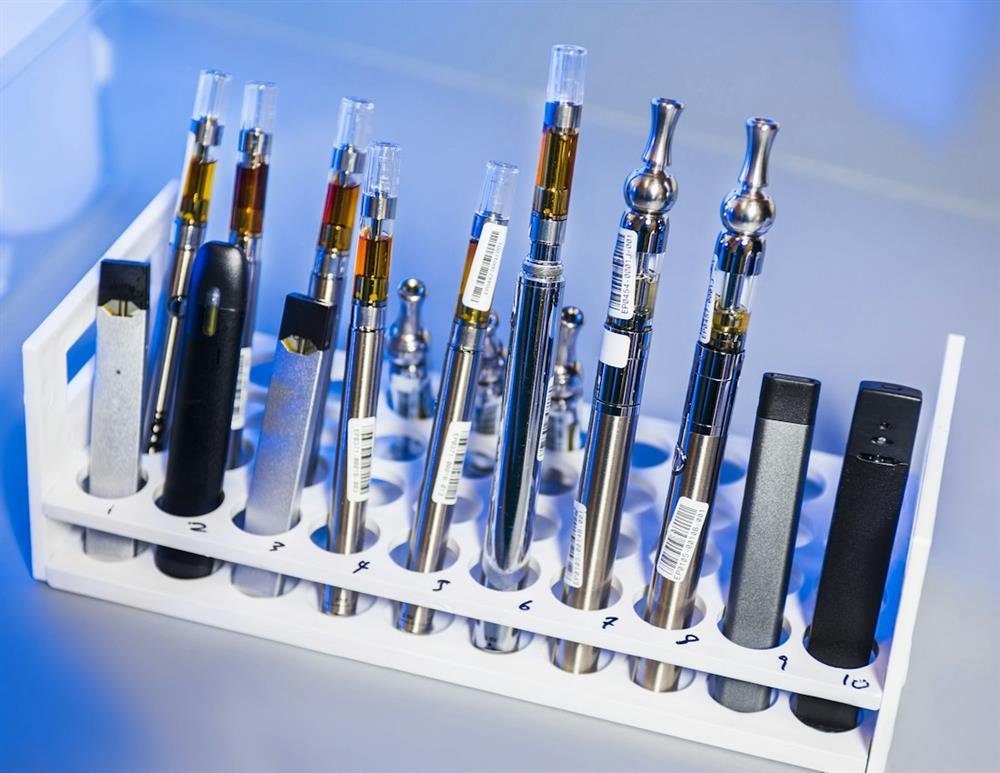 Vape device samples lined up in a test rack for quality checks